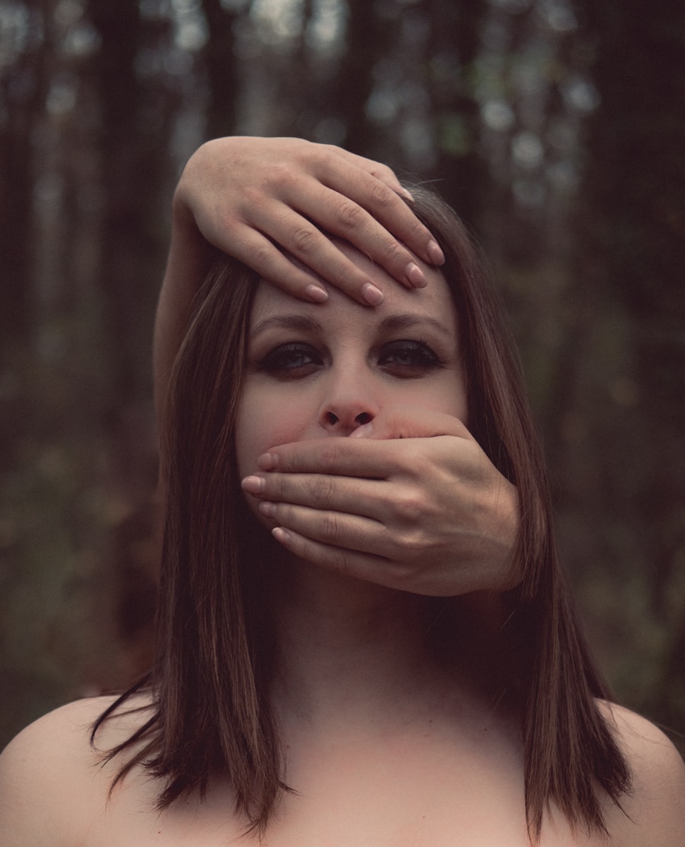 woman standing near trees